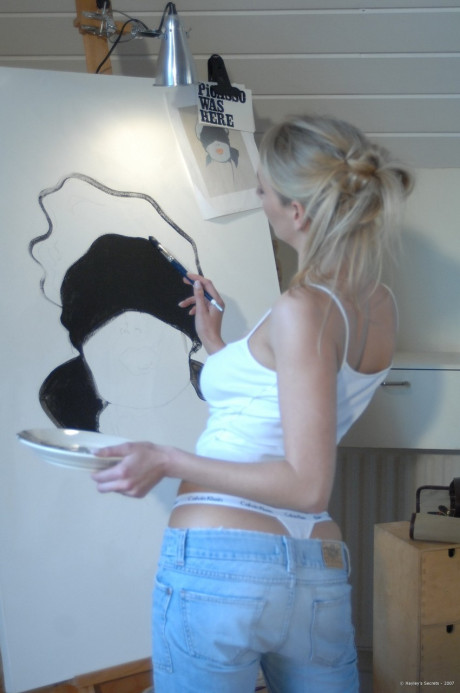 Yellow-haired MILF Hayley Marie Coppin unveils her great melons while painting