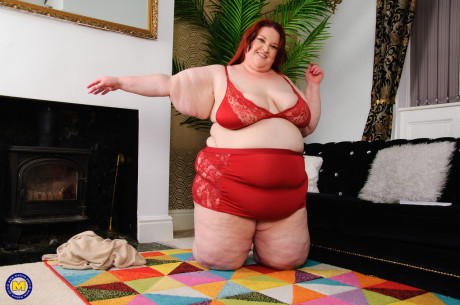 Cougar redheaded SSBBW Missy reveals her large melons and masturbates in a solo