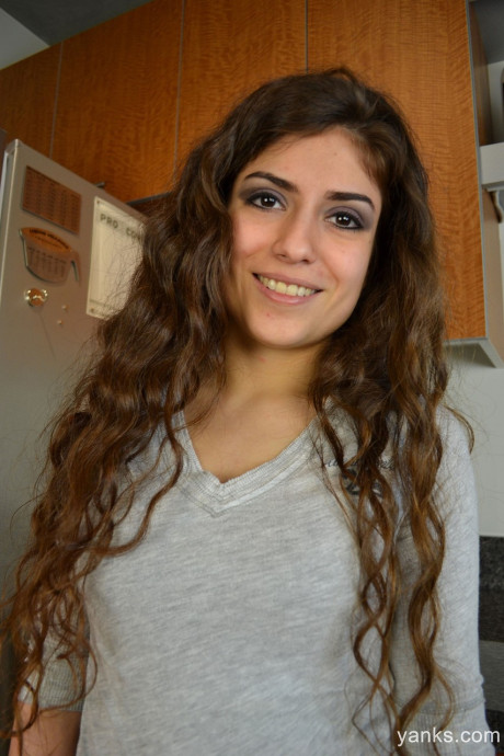 Brunette hispanic Carmen Monroe spreads legs and masturbates in a cuisine