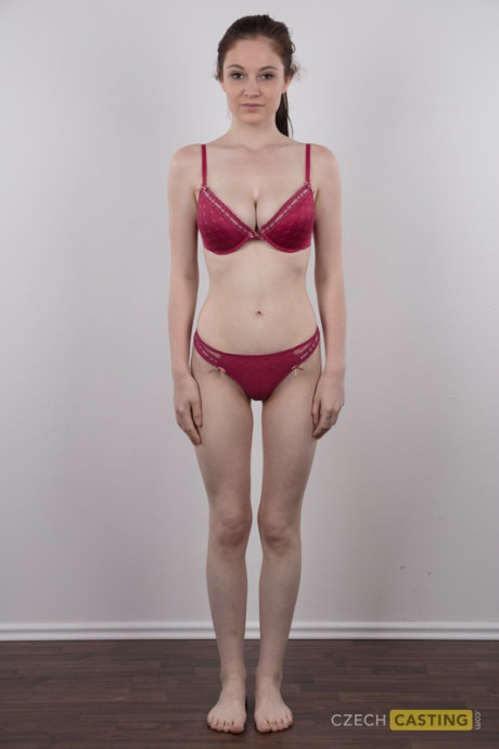 Tall teen Denisa shows her bald twat after standing naked for a modeling gig