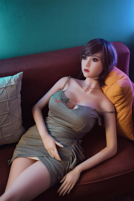 Ravishing chinese sex doll shows her flawless stacked body in a sweet dress