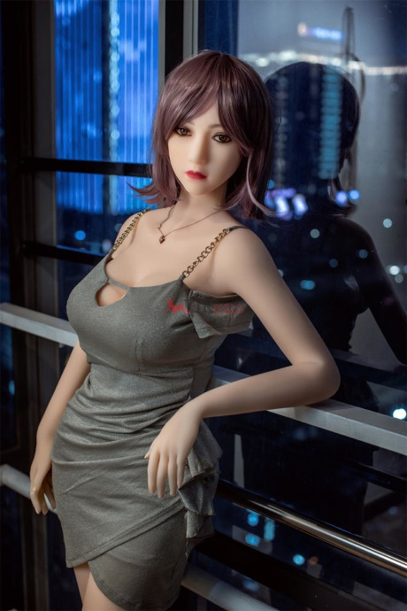 Ravishing chinese sex doll shows her flawless stacked body in a sweet dress