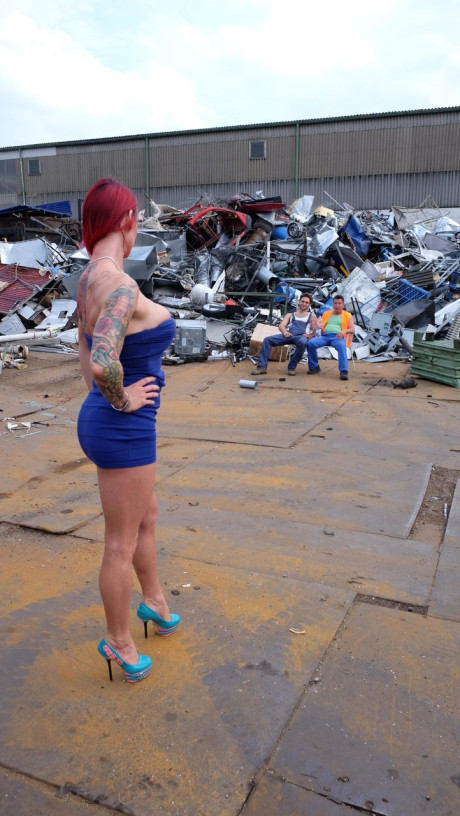 Red Hair MILF with tattoos and fake boobies gets pounded in a junk yard 3some