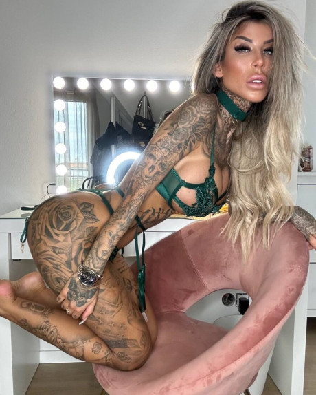 Yellow-haired amateur Jacky Inked poses in green lacy undies in a cute solo