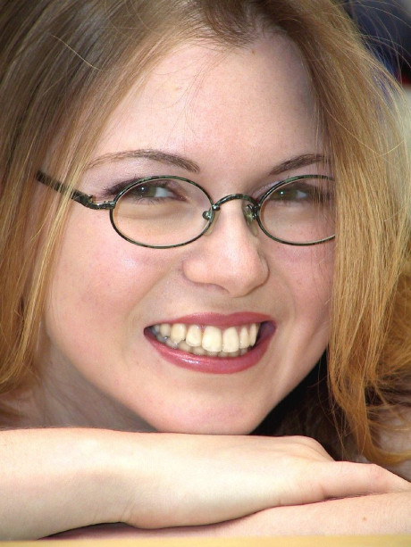 Teenie amateur in glasses poses undressed and flaunts her soft cute skin