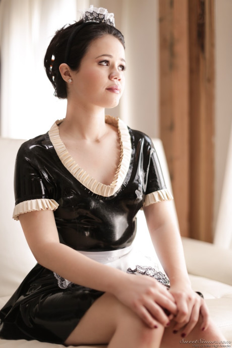 Beautiful fresh teen maid Yhivi slips off uniform to model nude in the window