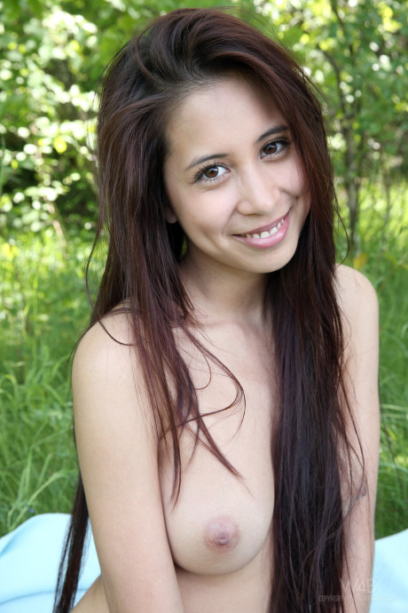 Long-haired teen cutie Paula Shy shows her cute tits & tight holes outdoors