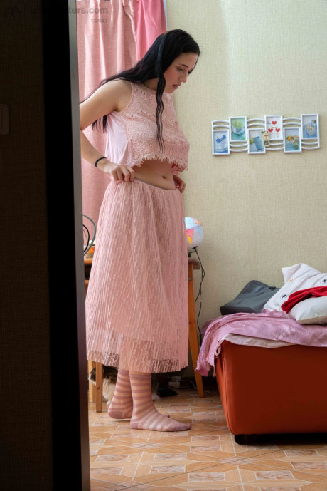Tall brunette Elza flashing her tight behind & her humongous areolas while dressiing
