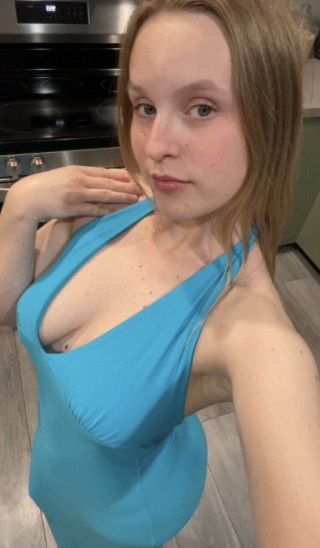 Amateur bitch girl lady looses her firm boobies from a blue dress in a galley