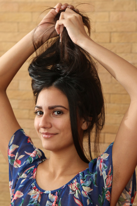 Dark haired lady GF girl Cira Nerri stares out with stunning eyes while getting naked