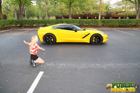 Yellow-haired Odette Delacroix shows her tiny melons while giving a handjob outdoors