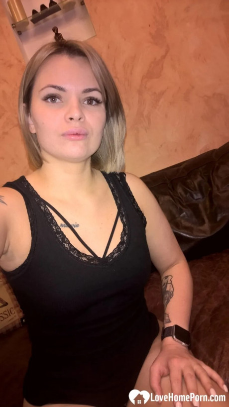 Yellow-haired babe shows her small boobs & her shaved cunt in black undies