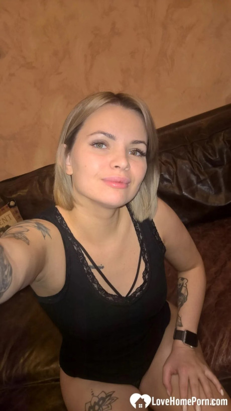 Yellow-haired babe shows her small boobs & her shaved cunt in black undies