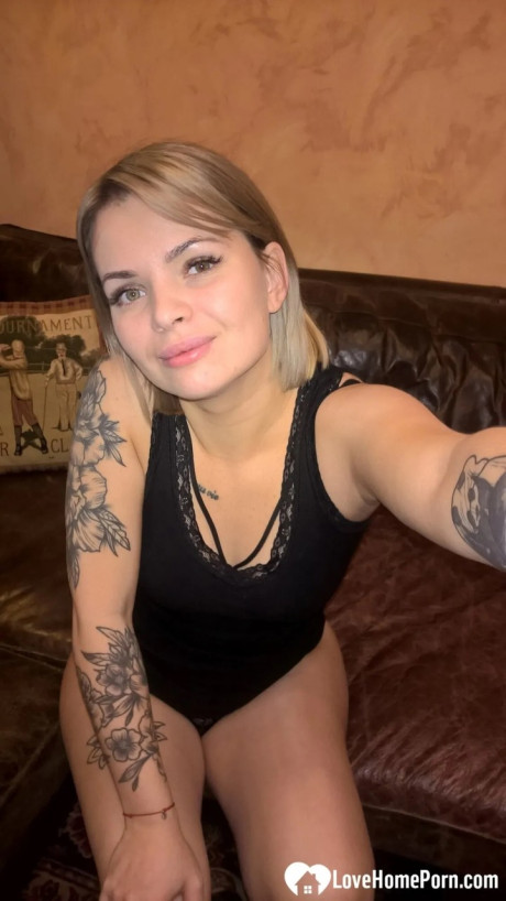 Yellow-haired babe shows her small boobs & her shaved cunt in black undies