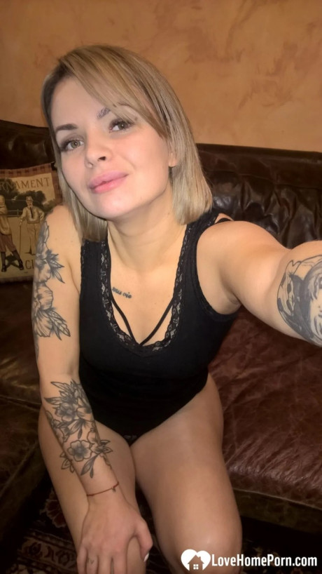 Yellow-haired babe shows her small boobs & her shaved cunt in black undies