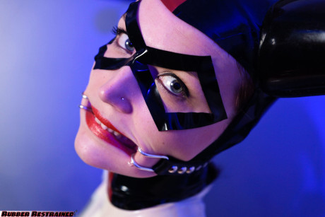 Solo model Dutch Dame sports a mouth spreader while in a rubber costume