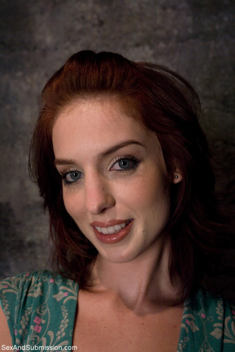 Sexy redheaded fiance Riley Shy gets tied up and spanked in a BDSM cage