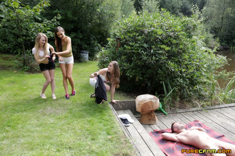 Pretty Tina Kay and her friends give a handjob and lick a dick outdoors