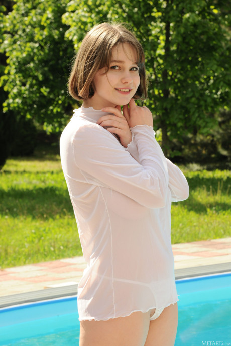 Young Aurelia Lu strips her sheer shirt & plays with her enormous boobies & nipples