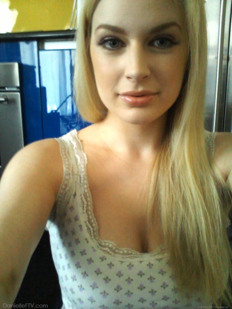 Large boobed amateur is joined by a girlfriend during one of her self shots