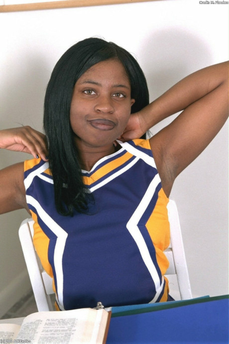 Ebony amateur cheerleader Holly flaunts her monstrous breasts and monstrous behind in a solo