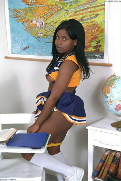 Ebony amateur cheerleader Holly flaunts her monstrous breasts and monstrous behind in a solo