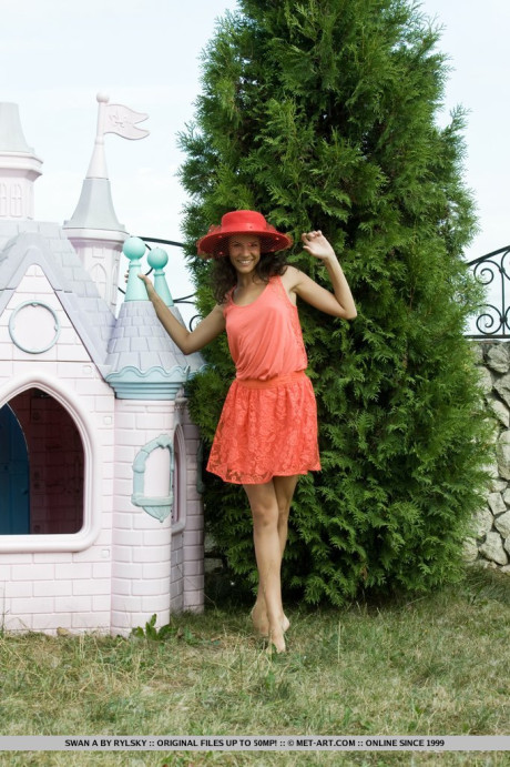 Young young Russian beauty Swan A gets totally nude out in a backyard