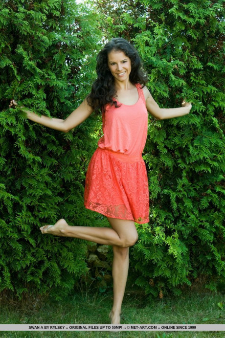 Young young Russian beauty Swan A gets totally nude out in a backyard