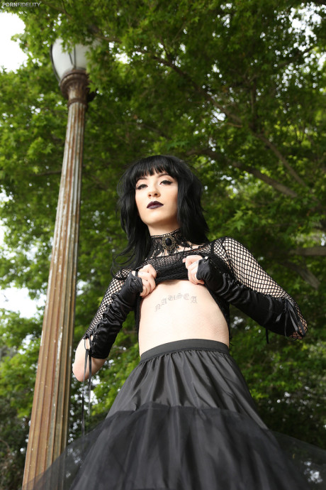 Goth pornstar in ebony Charlotte Sartre rides Ryan Madison's dong in the bed