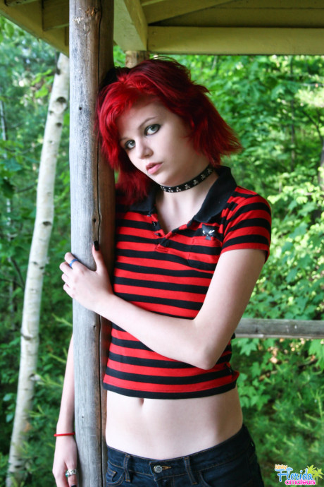 Fine redheaded bitch GF woman teen Satine uncovers her small tits on a rustic porch