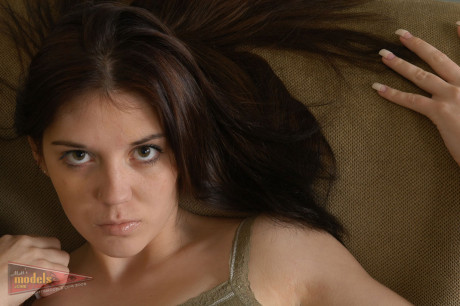 Young amateur Siena piles up her hair before finger spreading her pierced snatch