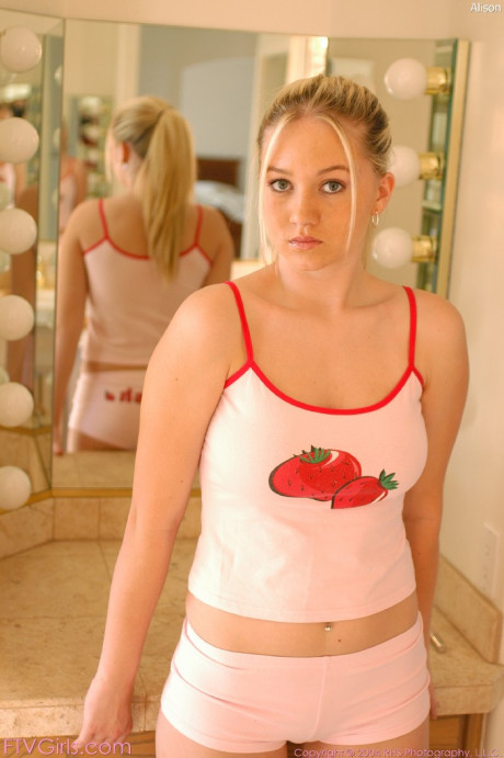 Curvy young Alison flaunts her big boobs and squeezes her cunt lips