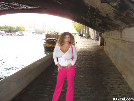 Curly haired babe Angel Crisa exposes her mesmerizing tits and poses in public