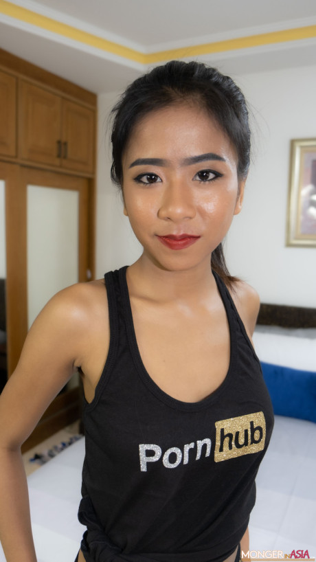 Thai sweetie Som poses in her PornHub outfit & shows her monstrous tits & ass