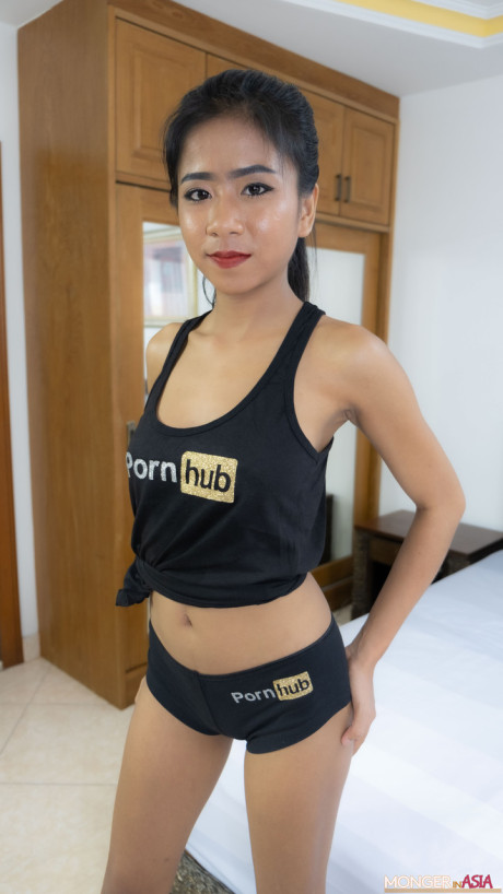 Thai sweetie Som poses in her PornHub outfit & shows her monstrous tits & ass