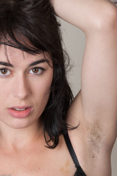 Brunette amateur Olive strips naked and shows her humongous behind & furry vagina