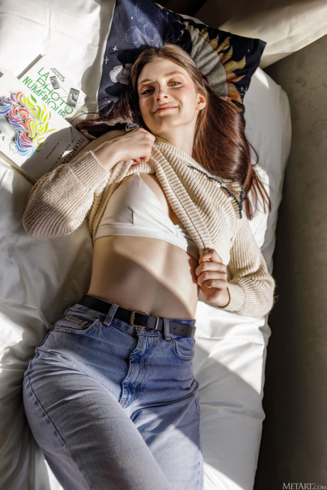 Beautiful young girl gf lady with long hair gets totally undressed on her bed