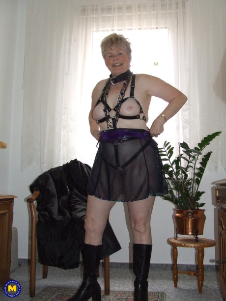 Mature BBW with short spiky hair takes off lingerie and fetish gear to go nude