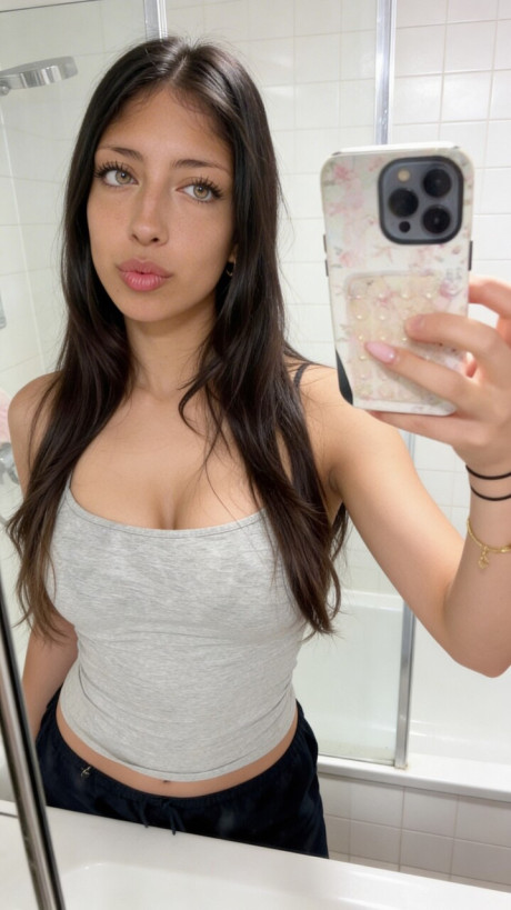 Brunette amateur takes selfie shots in a number of different outfits