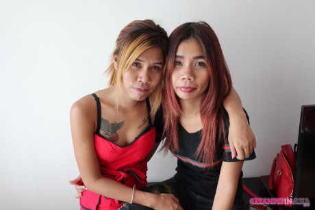 Sleazy asian babes Kuai & Jem tease with their inked bodies together