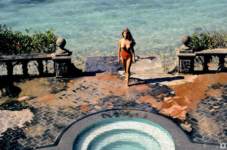 Vintage centerfold Terri Welles baring her giant titties and bushy vagina outdoors