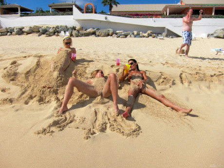 Blonde lesbian Bibi Noel & her slutty GFs fool around while undressed at the beach