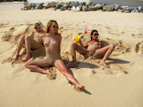 Blonde lesbian Bibi Noel & her slutty GFs fool around while undressed at the beach