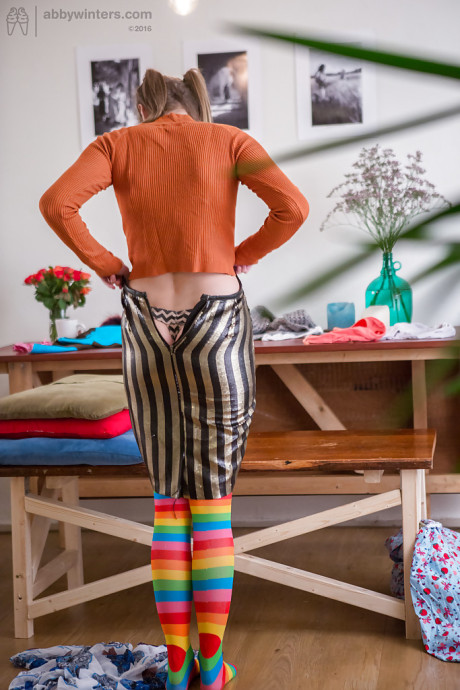 Yellow-haired amateur Katherine J getting dressed after posing in the undressed