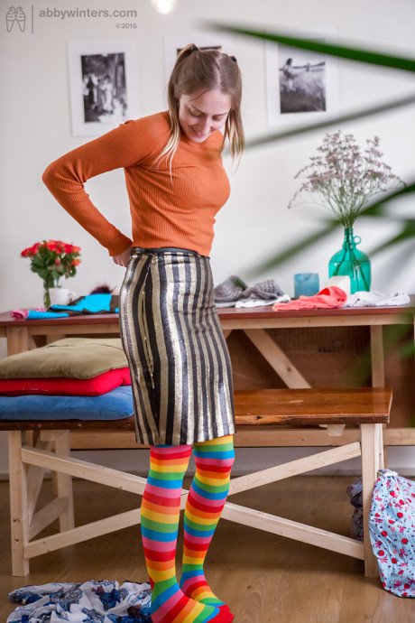 Yellow-haired amateur Katherine J getting dressed after posing in the undressed