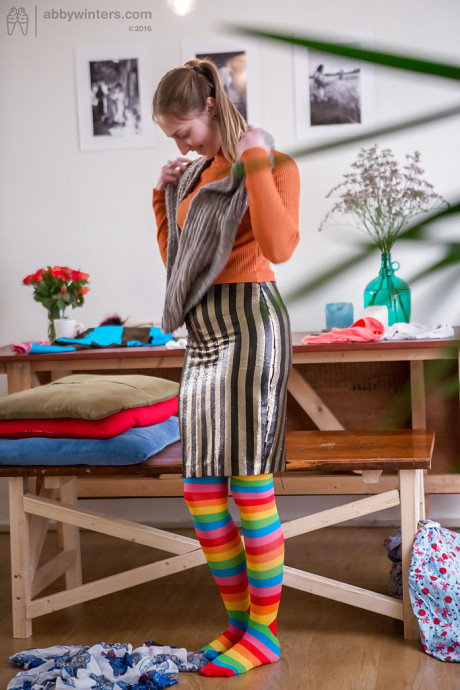 Yellow-haired amateur Katherine J getting dressed after posing in the undressed