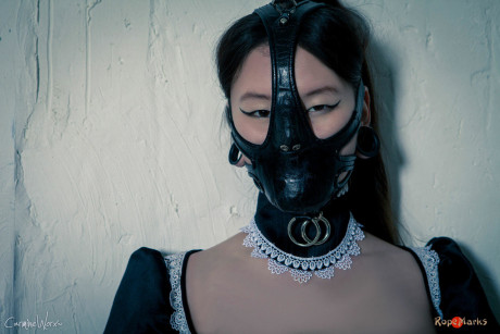 Korean model poses for a solo shoot in a dirty rubber maid outfit