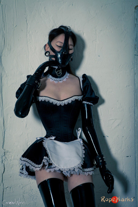 Korean model poses for a solo shoot in a dirty rubber maid outfit