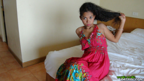 Curly-haired Thai babe Nees shows her pretty boobies & her bald vagina