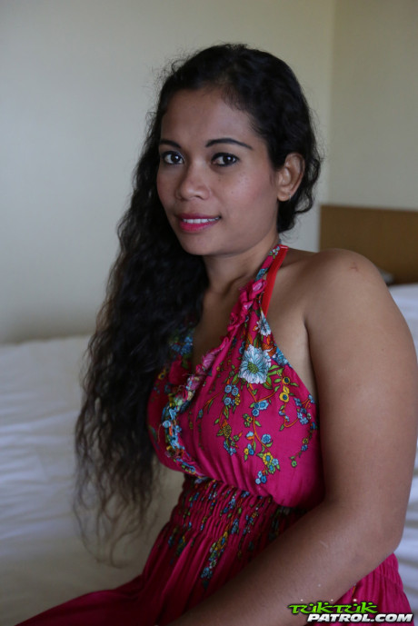 Curly-haired Thai babe Nees shows her pretty boobies & her bald vagina
